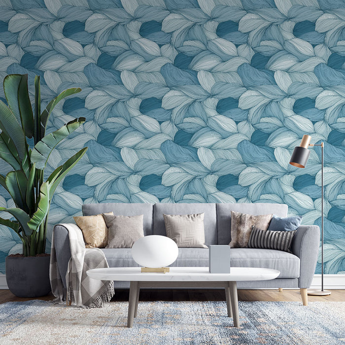 Un salon moderne avec un papier peint aux motifs de feuilles en dégradé de bleu, créant une ambiance apaisante et élégante.