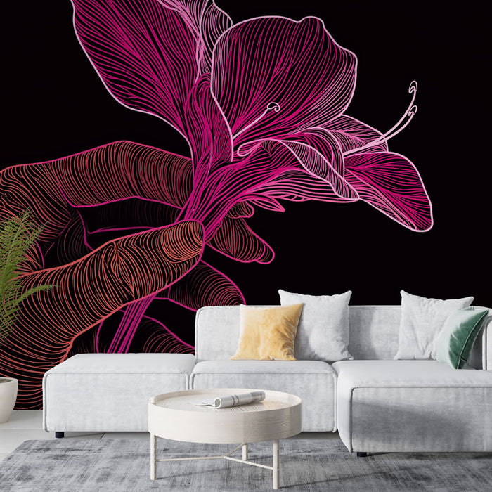 Un salon moderne avec un papier peint artistique représentant une main tenant une fleur aux lignes roses sur fond noir, créant une ambiance élégante et contemporaine.