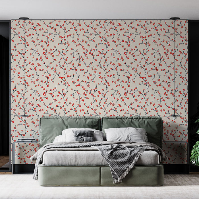 Une chambre moderne avec un papier peint floral crème orné de délicates branches rouges et bleues, créant une atmosphère douce et accueillante.