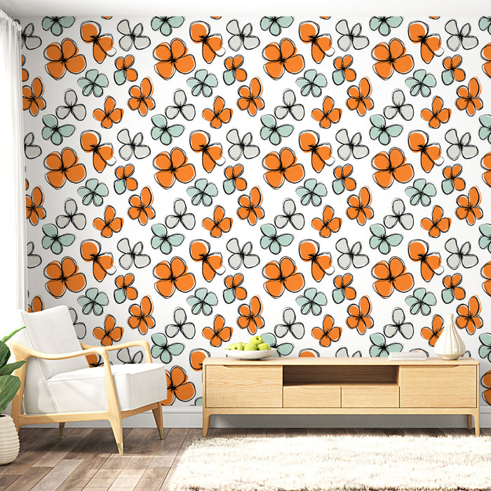 Un salon lumineux avec un papier peint floral aux motifs colorés d'orange et de vert sur fond blanc, créant une ambiance joyeuse et dynamique.