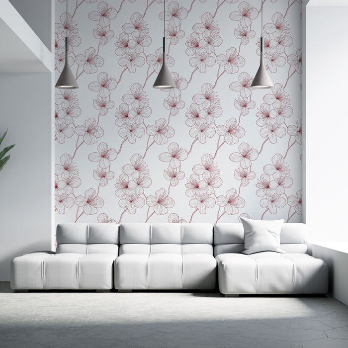 Un salon moderne avec un papier peint floral aux motifs délicats de fleurs rouges sur fond blanc, créant une ambiance douce et élégante.
