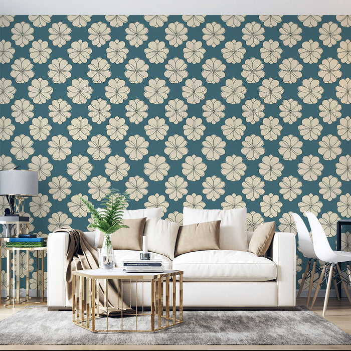 Un salon moderne avec un papier peint floral bleu canard et crème, aux motifs de fleurs stylisées, créant une ambiance fraîche et accueillante.