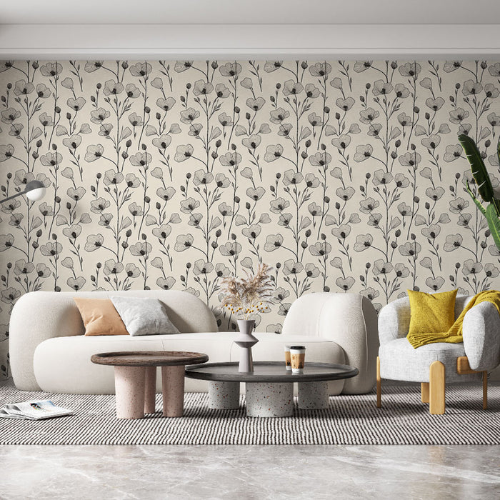 Un salon moderne avec un papier peint floral beige et noir, présentant des motifs délicats de fleurs sur fond clair, créant une atmosphère douce et élégante.