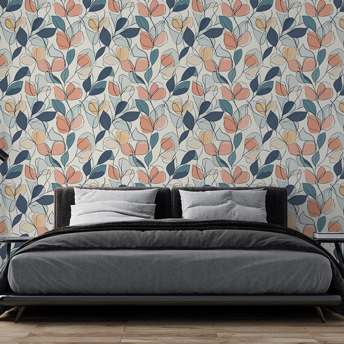 Une chambre moderne avec un papier peint floral aux motifs colorés de fleurs roses, bleues et jaunes sur fond clair, créant une atmosphère douce et accueillante.