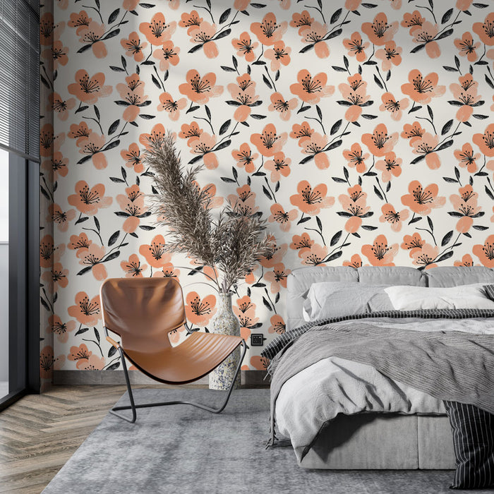 Une chambre moderne avec un papier peint floral aux motifs orange et noirs sur fond clair, créant une ambiance chaleureuse et accueillante.