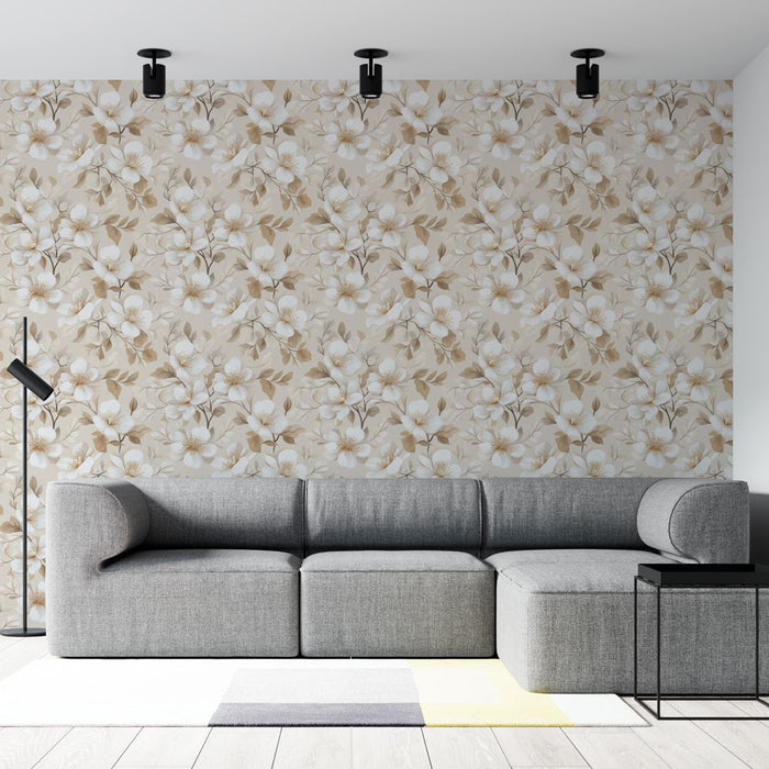Un salon moderne avec un papier peint floral aux motifs de fleurs blanches et dorées sur fond beige, créant une atmosphère douce et accueillante.
