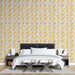 Une chambre moderne avec un papier peint floral beige orné de délicates tiges marron et de fleurs jaunes, créant une ambiance chaleureuse et accueillante.