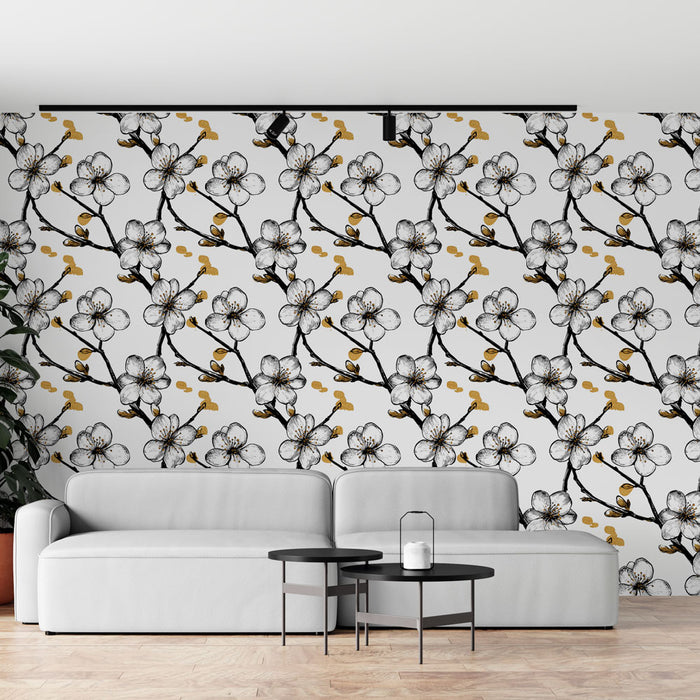 Un salon moderne avec un papier peint floral noir et blanc orné de fleurs délicates et de touches dorées, créant une ambiance élégante et apaisante.