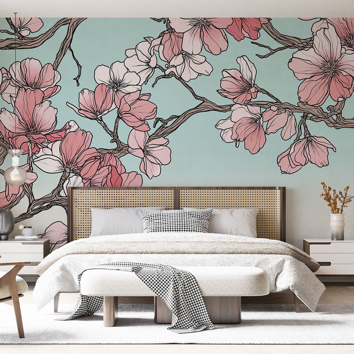 Une chambre lumineuse avec un papier peint floral aux motifs de fleurs roses et blanches sur fond bleu pastel, créant une ambiance douce et apaisante.