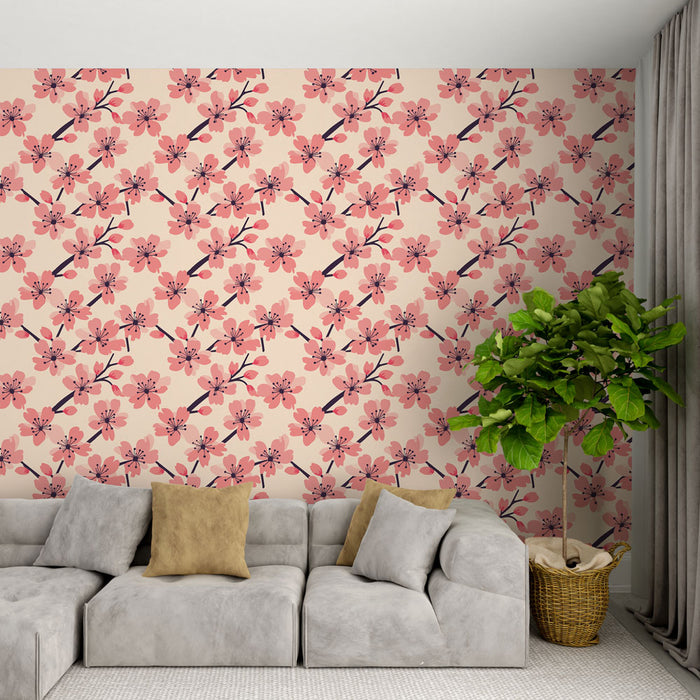 Un salon moderne avec un papier peint floral aux motifs de fleurs roses sur fond crème, créant une atmosphère douce et accueillante.