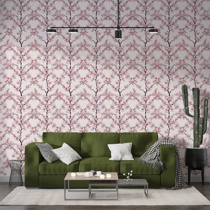 Un salon contemporain avec un papier peint floral aux motifs de branches de cerisier rose sur fond clair, créant une atmosphère douce et accueillante.