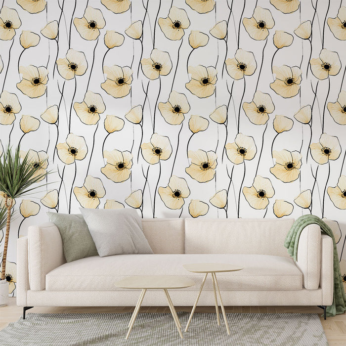 Un salon lumineux avec un papier peint floral représentant des coquelicots jaunes sur fond blanc, créant une atmosphère douce et apaisante.