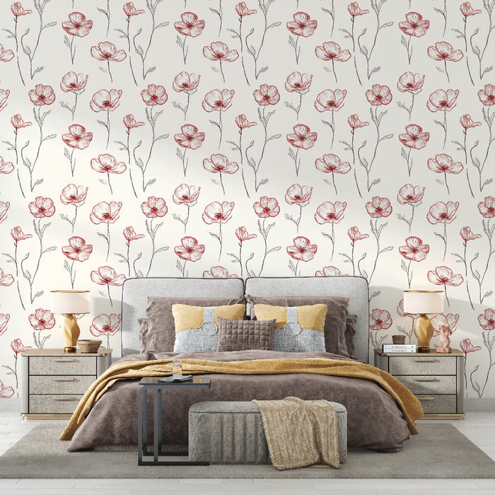 Une chambre élégante avec un papier peint floral aux motifs de coquelicots rouges sur fond crème, créant une atmosphère douce et romantique.