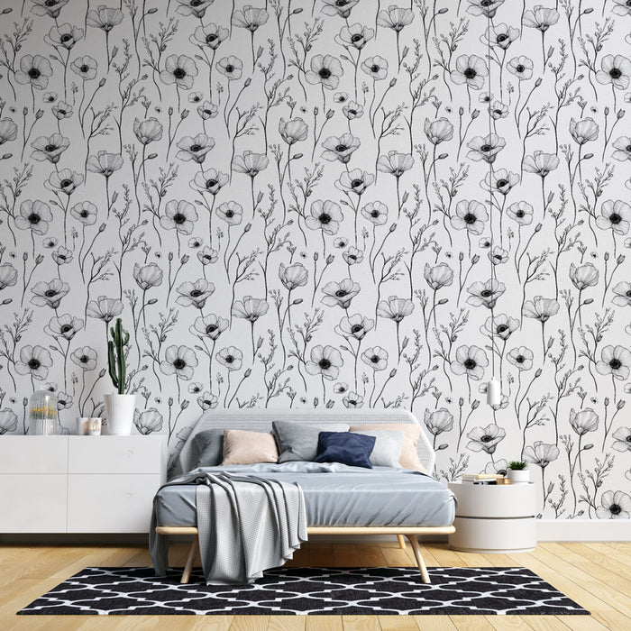 Une chambre moderne avec un papier peint floral noir et blanc représentant des fleurs délicates sur fond clair, créant une atmosphère élégante et apaisante.