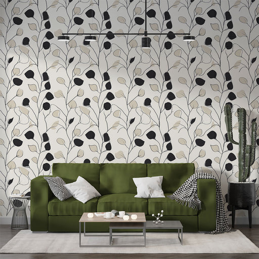 Un salon contemporain avec un papier peint aux motifs de branches stylisées en noir et beige sur fond clair, créant une atmosphère élégante et apaisante.