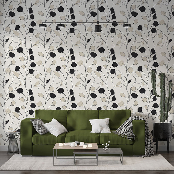 Un salon contemporain avec un papier peint aux motifs de branches stylisées en noir et beige sur fond clair, créant une atmosphère élégante et apaisante.