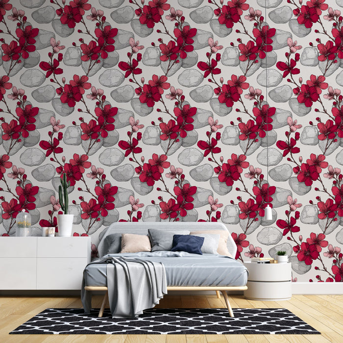 Une chambre moderne avec un papier peint floral aux motifs de fleurs rouges et grises sur fond clair, créant une ambiance chaleureuse et accueillante.