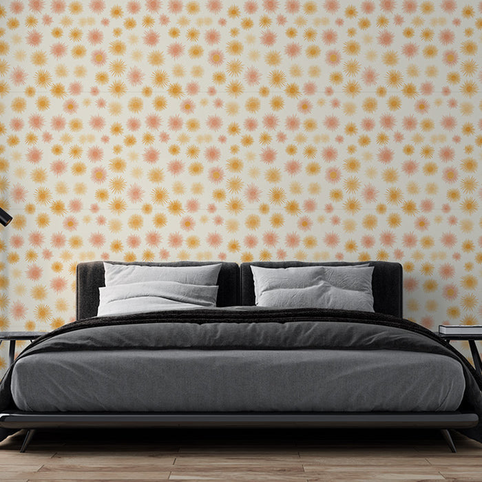Une chambre moderne avec un papier peint aux motifs ensoleillés dans des teintes de rose et jaune sur fond clair, créant une atmosphère chaleureuse et joyeuse.