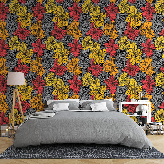Une chambre moderne avec un papier peint floral vibrant aux motifs de fleurs rouges, jaunes et noires, créant une ambiance dynamique et chaleureuse.