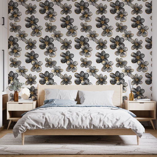 Une chambre moderne avec un papier peint floral noir et or sur fond blanc, créant une ambiance élégante et artistique.