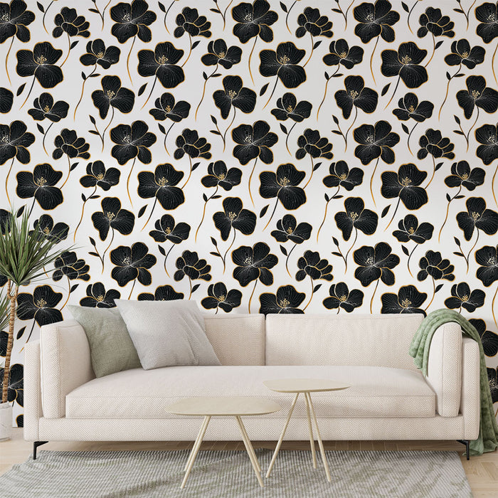 Un salon moderne avec un papier peint floral noir et doré sur fond blanc, créant une ambiance élégante et sophistiquée.