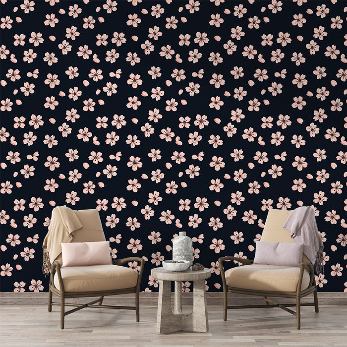 Une pièce de vie élégante avec un papier peint floral sur fond noir, ornée de délicates fleurs roses créant une atmosphère chaleureuse et accueillante.