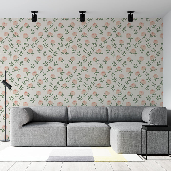 Un salon moderne avec un papier peint floral aux motifs de fleurs roses et feuillage vert sur fond clair, créant une atmosphère douce et accueillante.