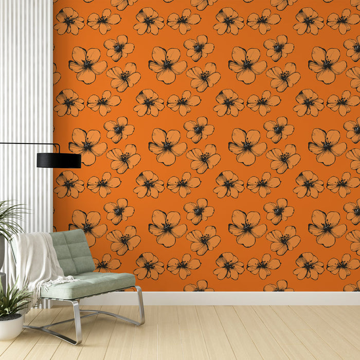Un salon contemporain avec un papier peint orange vif orné de fleurs noires délicates, créant une atmosphère chaleureuse et dynamique.