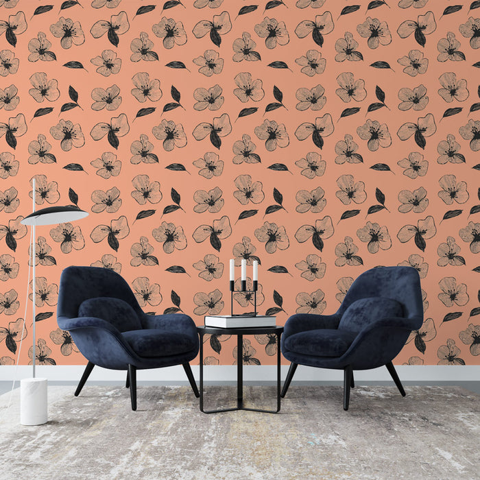 Un salon moderne avec un papier peint floral sur fond pêche, orné de délicates fleurs noires et de feuilles, créant une ambiance chaleureuse et accueillante.