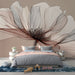 Une chambre moderne avec un papier peint représentant une grande fleur stylisée aux lignes délicates et aux teintes douces, créant une atmosphère apaisante et élégante.