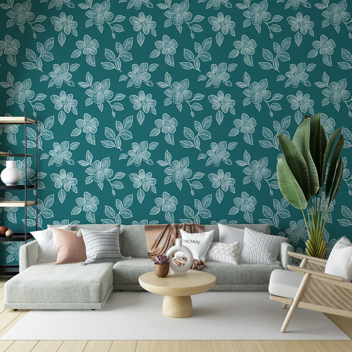 Un salon moderne avec un papier peint floral bleu canard aux motifs blancs délicats, créant une atmosphère fraîche et accueillante.