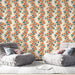 Une pièce moderne avec un papier peint floral aux motifs d'orange et de bleu sur fond crème, créant une atmosphère chaleureuse et accueillante.