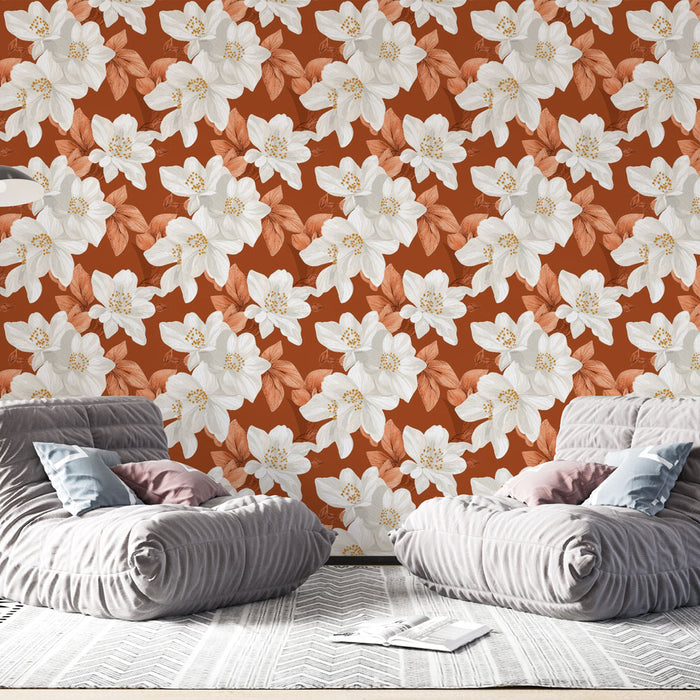 Une pièce moderne avec un papier peint floral aux grandes fleurs blanches et feuilles terracotta sur fond rouge, créant une ambiance chaleureuse et accueillante.