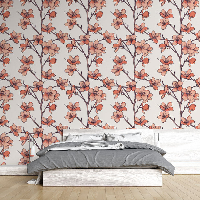 Une chambre moderne avec un papier peint floral aux motifs de fleurs roses et branches délicates sur fond clair, créant une atmosphère douce et apaisante.