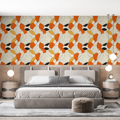 Une chambre moderne avec un papier peint floral aux motifs stylisés orange, noir et beige créant une ambiance chaleureuse et dynamique.
