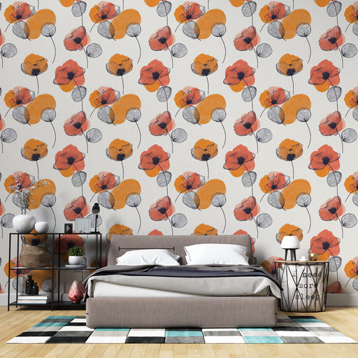 Une chambre moderne avec un papier peint floral aux motifs de coquelicots rouges et éléments graphiques orange, créant une ambiance chaleureuse et artistique.