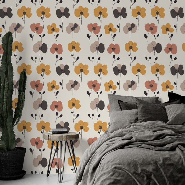 Une chambre moderne avec un papier peint floral aux teintes chaudes de jaune, rose et noir, créant une atmosphère accueillante et joyeuse.