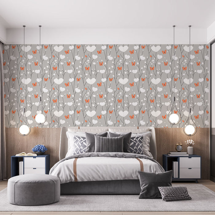 Une chambre moderne avec un papier peint floral gris orné de coeurs blancs et de papillons orange, créant une atmosphère douce et accueillante.