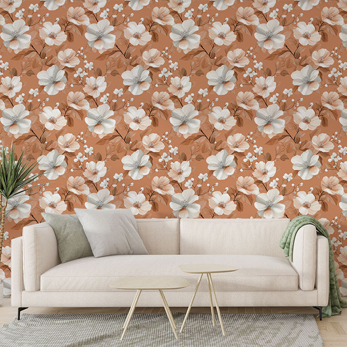 Un salon moderne avec un papier peint floral aux teintes chaudes de terre cuite, orné de fleurs blanches et roses, créant une ambiance accueillante et douce.