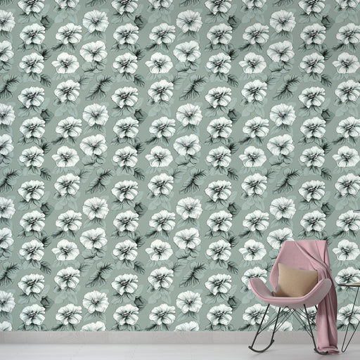 Une pièce moderne avec un papier peint floral aux motifs de fleurs blanches sur fond vert doux, créant une ambiance apaisante et élégante.