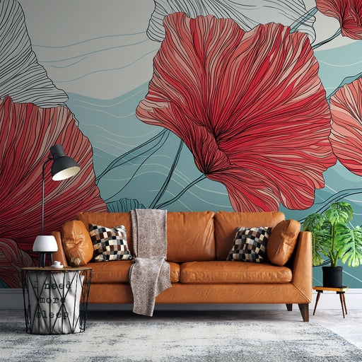 Un salon moderne avec un papier peint floral aux grandes fleurs rouges et lignes délicates sur fond bleu, créant une ambiance chaleureuse et artistique.