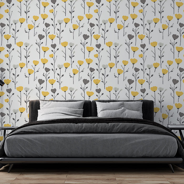 Une chambre moderne avec un papier peint floral blanc, jaune et gris, créant une atmosphère joyeuse et accueillante.