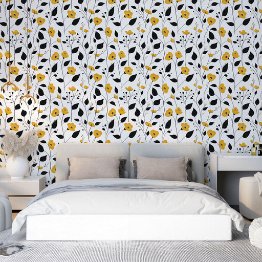 Une chambre moderne avec un papier peint floral aux motifs jaunes et noirs sur fond blanc, créant une ambiance joyeuse et dynamique.