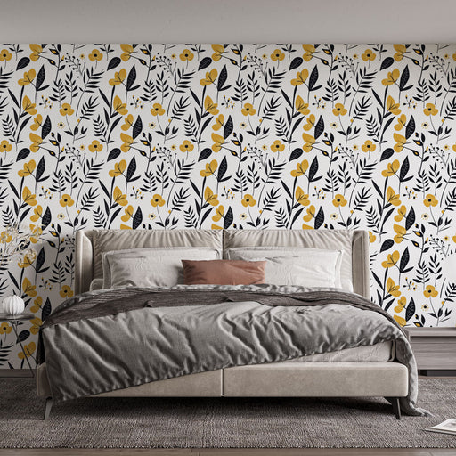 Une chambre moderne avec un papier peint floral noir et jaune sur fond blanc, créant une ambiance joyeuse et dynamique.