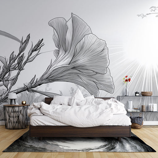 Une chambre moderne avec un papier peint floral en noir et blanc, représentant de grandes fleurs stylisées, créant une ambiance artistique et apaisante.
