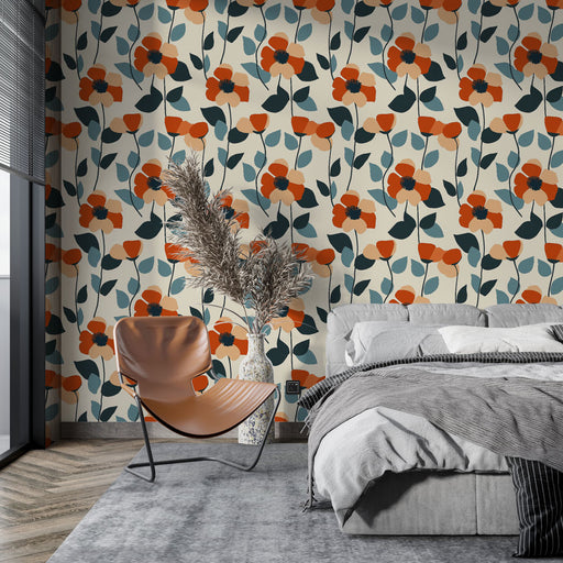 Une chambre moderne avec un papier peint floral aux motifs vibrants d'orange et de bleu sur fond clair, créant une ambiance chaleureuse et accueillante.