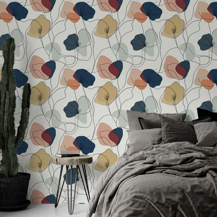 Une chambre moderne avec un papier peint aux motifs floraux abstraits, mêlant des teintes douces et vives sur fond clair, créant une atmosphère chaleureuse et artistique.