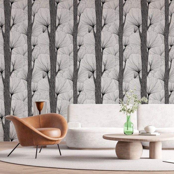 Un salon moderne avec un papier peint monochrome représentant des motifs de feuilles stylisées sur fond clair, créant une ambiance élégante et apaisante.