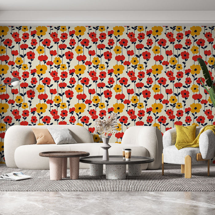 Un salon lumineux avec un papier peint floral aux motifs colorés de fleurs rouges, jaunes et bleues sur fond clair, créant une ambiance joyeuse et accueillante.