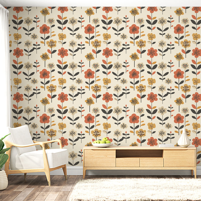 Un salon lumineux avec un papier peint floral aux motifs colorés de fleurs rouges, jaunes et noires sur fond crème, créant une ambiance chaleureuse et accueillante.